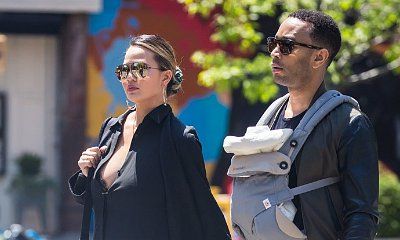 Chrissy Teigen Attempts to Prank Haters With Fake Baby Luna at the NBA Finals. Does It Work?