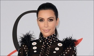 Kim Kardashian's Boobs Almost Spill Out of Her Tiny Bikini. Check Out the Sexy Pic!