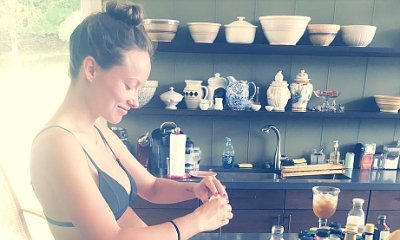 Olivia Wilde Bares Burgeoning Baby Bump While Cooking in Tiny Bra