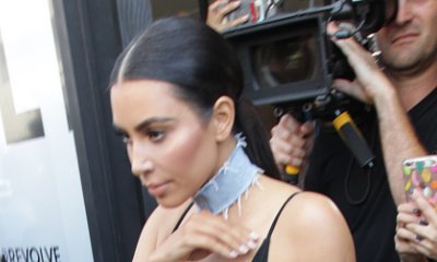Kim Kardashian Spills Out of Her Skintight LBD