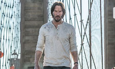 Keanu Reeves Walks Down Brooklyn Bridge With His New Dog in New 'John Wick 2' Pic