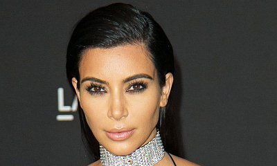 Kim Kardashian Nearly Spills Out of This Revealing Lacy Lingerie