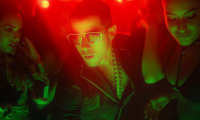 Nick Jonas Surrounded by Sexy Ladies in 'Champagne Problems' Music Video