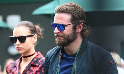 Irina Shayk Is Pregnant With Bradley Cooper's Child, Debuts Bump at VS Show