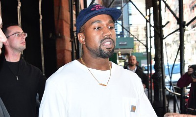 Kanye West Is a 'Wallflower' at Kardashian Christmas Party