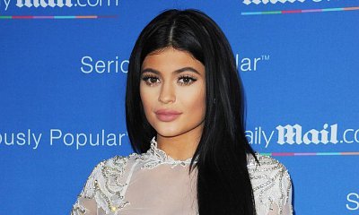 Kylie Jenner Flaunts Famous Derriere in Racy Fishnet Tights