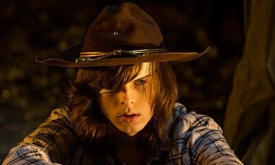 New 'The Walking Dead' Photo Teases Graphic Scene for Carl in 'Sing Me a Song'