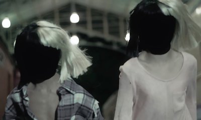 Sia Parallels 'Lion' Narratives in 'Never Give Up' Lyric Video