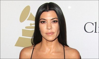 Kourtney Kardashian Hugs Mystery Man as Scott Disick Remains MIA