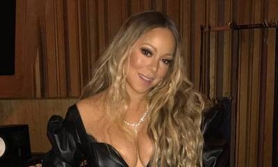 Mariah Carey's Boobs Almost Pop Out of Her Plunging Black Top
