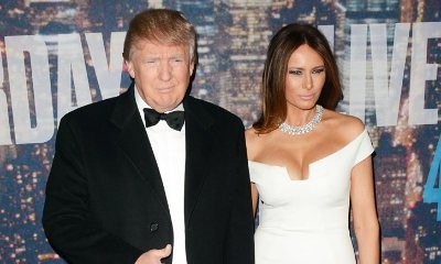 Melania Trump 'Fixes' Her Hair as Donald Trump Tries to Hold Her Hand