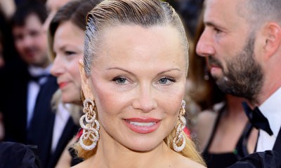 Peek-a-Boob! Pamela Anderson Flaunts Famous Cleavage in Slashed Gown in Monaco
