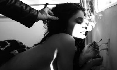 Topless Kylie Jenner Smokes Cigarette in Throwback Photo