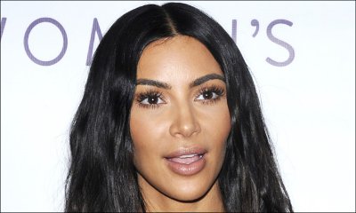 Kim Kardashian Is Basically Topless in Her Ripped Netted Outfit
