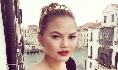 Braless Chrissy Teigen Almost Spills Out of Her Plunging Dress in Italy