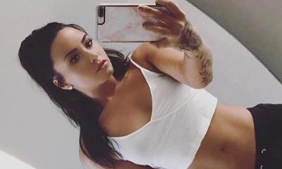 Demi Lovato Pulls Down Her Pants to Show Off Her Toned Midriff