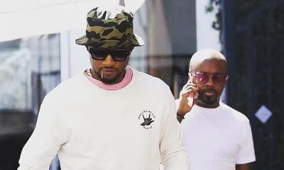 Usher Is All Smiles as He Steps Out for Coffee Amid STD Scandal