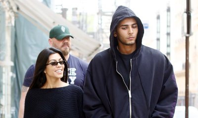 Kourtney Kardashian Smooches Younes Bendjima at Paris Soccer Game, but He Seems Distracted