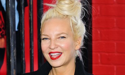 Sia Accidentally Flashes Her Boob in Rare Picture Showing Her Face