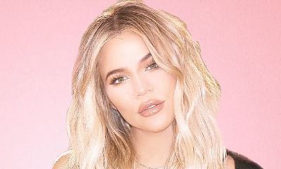Khloe Kardashian Shows Off Growing Baby Bump at Family Christmas Eve Party