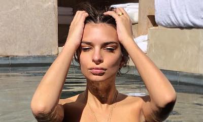 Emily Ratajkowski Poses Topless While Flashing Wedding Ring in Steamy Pool Snap