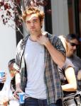 Robert Pattinson Hit by Taxi While Escaping Hysterical Fans