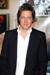 Hugh Grant Taught How to Use Weapon During Childhood Christmas