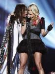 Video: Carrie Underwood and Steven Tyler Kiss on ACM Awards Stage