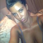 Kim Kardashian Takes a Shot at Tanning Mom in Twitter Photo