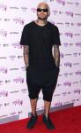 Rep: Chris Brown's 'Battered Woman' Tattoo Is Not Rihanna