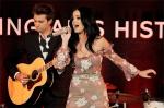Katy Perry Auctions Off Signed Guitar and a Date to Gay Bar