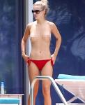 Joanna Krupa Ditches Bikini Top in Pool Frolic With Fiance
