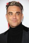 Robbie Williams Reveals Plan to Undergo Plastic Surgery