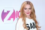Lindsay Lohan Loses Part of Fur Coat at a Club