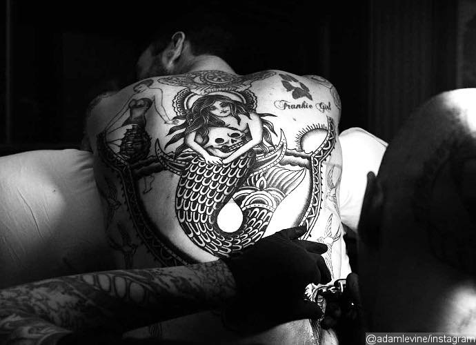 See Adam Levine's New Big Tattoo on His Back See Adam Levine's New Big Tattoo on His Back