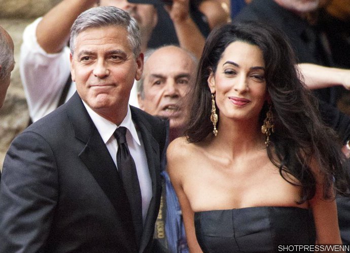 Amal Shows Off Baby Bump in Form-Fitting Gown as She Supports George Clooney at Cesar Awards