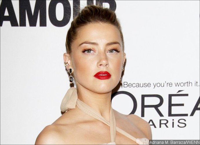 Video: Amber Heard Engaged in Steamy Makeout Session With Mystery Hunk