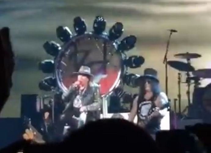Axl Rose Borrows Dave Grohl's Throne for Guns N' Roses Concert After Breaking His Foot