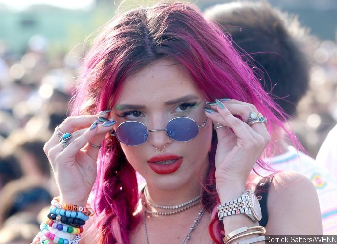 Bella Thorne Flaunts Boobs and Abs in Skimpy Red Bikini During Outing in L.A.