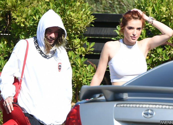 Braless Bella Thorne Flaunts Hairy Armpits in Sunny Outing With BF Mod Sun