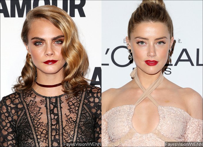New Couple Alert? Cara Delevingne and Amber Heard Reportedly 'Locking Lips' at Party