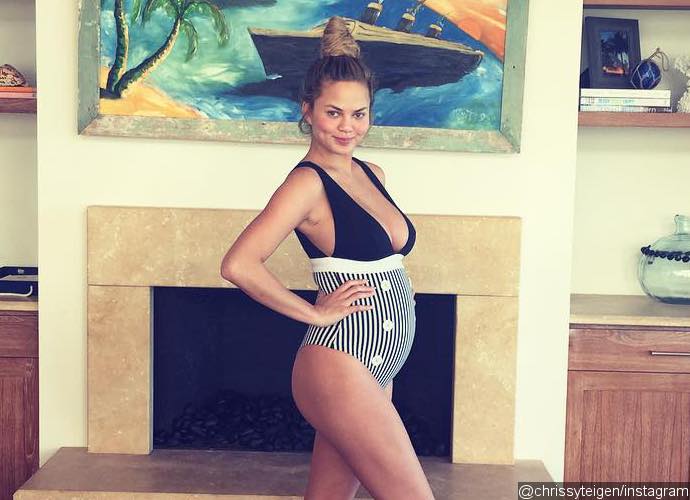 Chrissy Teigen Jokes About Her Baby Name After Flaunting 'Armpit Fat' in One-Piece Swimsuit