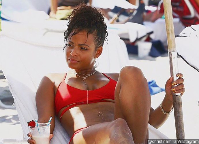 Christina Milian Flashes Major Underboob in Daring Red Bikini