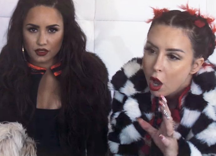 Watch Demi Lovato Hold a Man on a Leash in Sirah's Music Video for ...