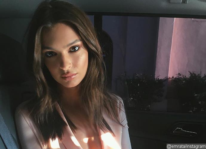 Emily Ratajkowski Poses Topless by the Pool in Cheeky Instagram Pic