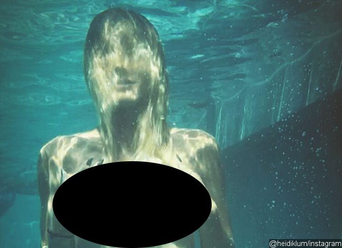 Heidi Klum Ditches Bikini Top for a Swim in These Steamy Photos