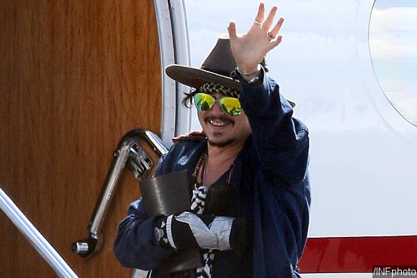 Injured Johnny Depp Sports Taped Up Hand When Leaving Australia