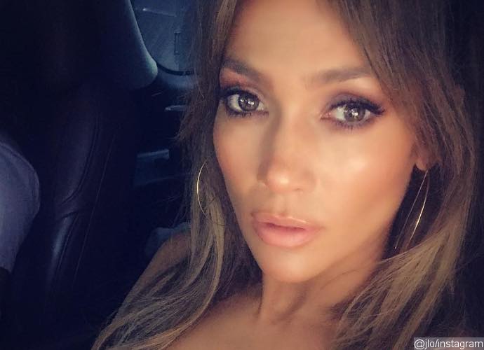 Jennifer Lopez Flaunts Major Cleavage and Bares Torso During Gym Session