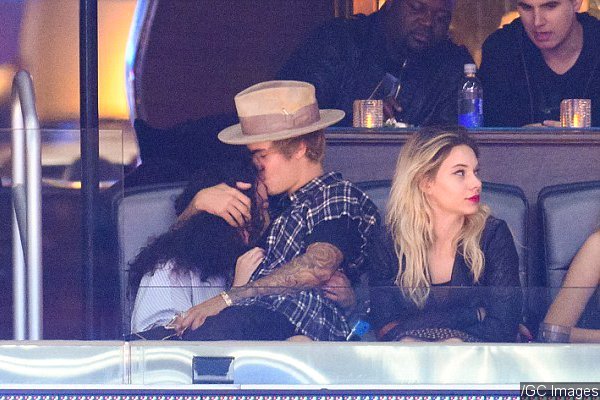Justin Bieber Kisses Ashley Moore and Sits on Her Lap at Clippers Game