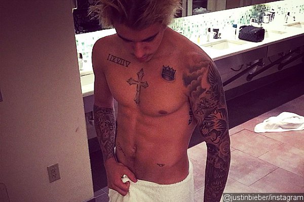 Justin Bieber Laughs Off Photoshop Claims With Real Abs Photo